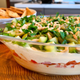 Illustration for article titled Take your summer 7-layer dip to the Mediterranean